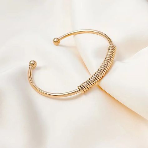 Elevate your style with timeless gold ball bracelets. Discover their history, types, and how to wear them for any occasion.