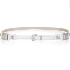 Elevate your outfit with a classic white studded belt. Add edge and glam to any look with this versatile accessory, perfect for dressing up or down.